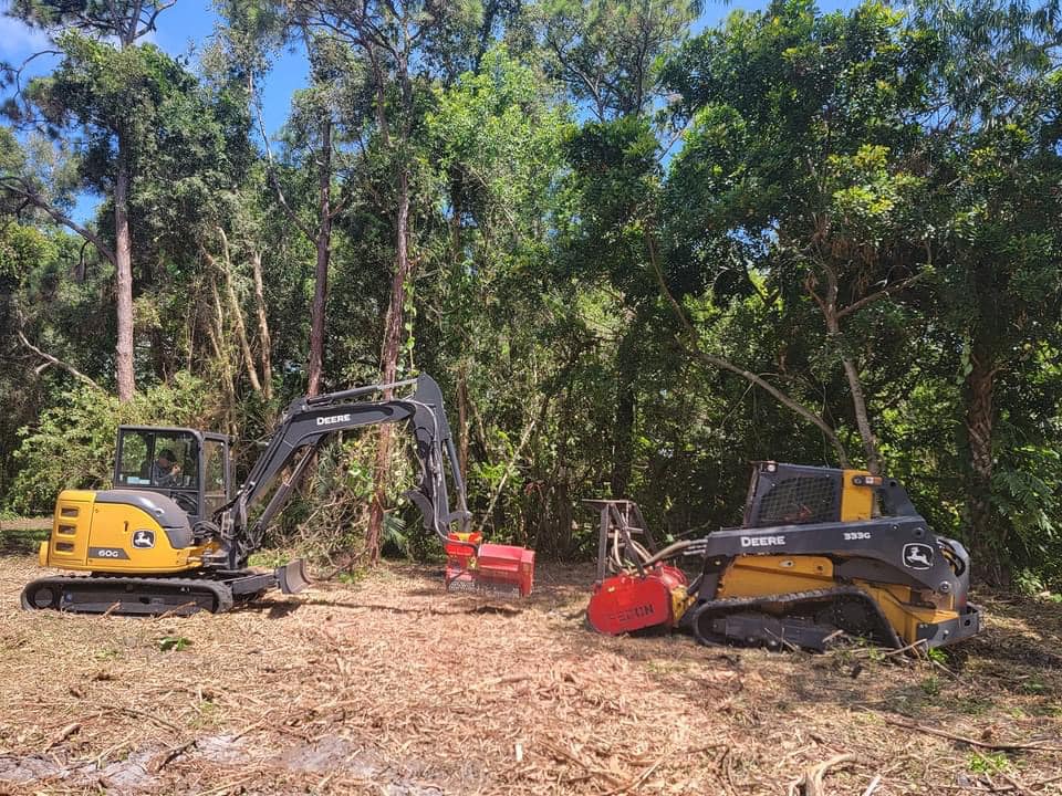 machines being used to clear land for a client